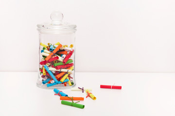 Small roll wish papers and a jar on white background. Wish jar. Wish concept. Dream, desire, wish,...