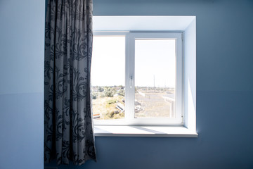 window to the street, sill and curtain, view from the room