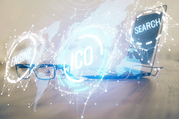 Multi exposure of blockchain theme hologram and table with computer background. Concept of bitcoin crypto currency.