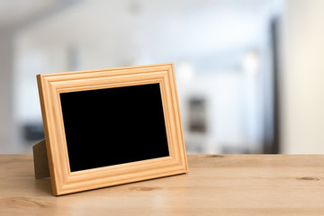 photo frame on the wooden table