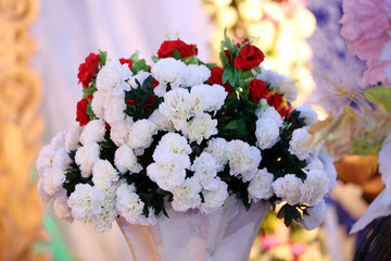beautiful bouquet of red and white flowers shallow focus blurry background