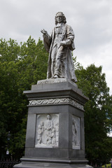 Fototapeta na wymiar A statue of Isaac Watts at Watts Park in Southampton, Hampshire, UK