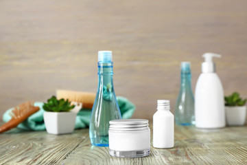 Cosmetics for hair on wooden table
