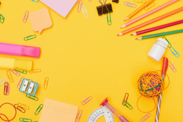 Back to school concept, school supplies on yellow background, university, college, flat lay with copy space