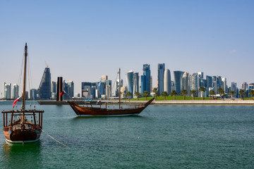 Fototapeta premium Dhow boat with Doha skyline in background