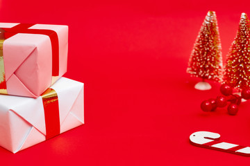 Christmas composition, gifts on red background, copy space