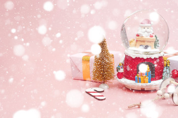 Christmas composition, gifts on pastel pink background, copy space