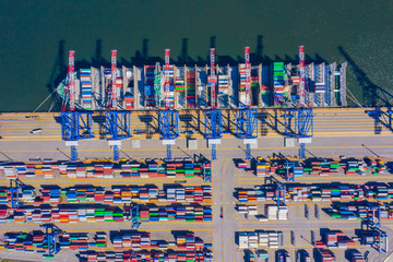 Container ship from sea port working for delivery containers shipment and container warehouse background. Suitable use for transport or import export to global logistics concept.