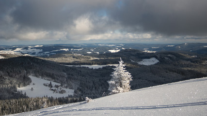 White winter mountain landscape. focus on mountains in the background.