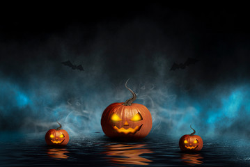 Dark night background in the forest, reflected in the water. Pumpkin is reflected from water, neon light, smoke, flashlight, fog. Halloween Party. 3d illustration