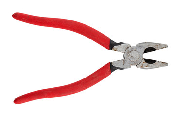 Old pliers with rubber grips in red on a white background. Top view. Repair or building concept.