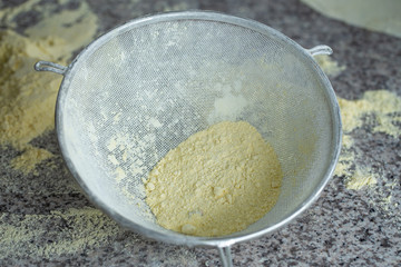 Iron sieve with flour