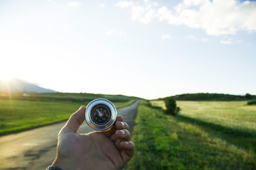 asphalt road and compass