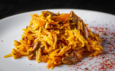 Rice with Vegetables and Meat in white plate