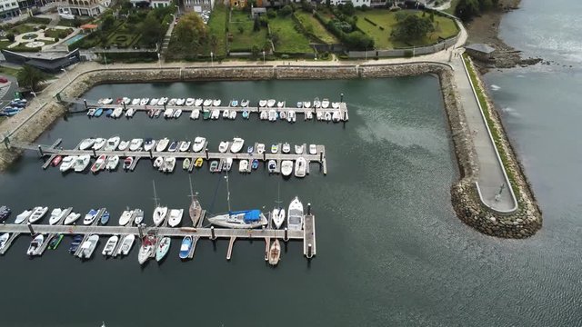 Boats in Harbour of Ortigueira, coastal village of A Coruña. Galicia,Spain. Aerial Drone Footage