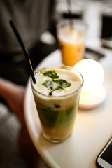 Closeup on matcha latte on the round cafe table