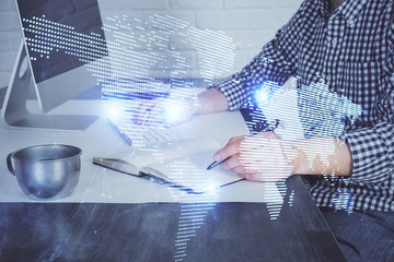 Social network theme hologram with businessman working on computer on background. Concept of world...