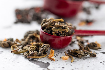 Closeup on measure spoons with leave tea