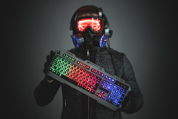 Futuristic sci fi man with a keyboard on a gray background.