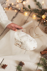 Christmas stollen on wooden background. Traditional Christmas festive pastry dessert. Stollen for Christmas.