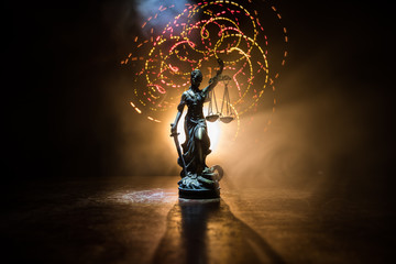 The Statue of Justice - lady justice or Iustitia / Justitia the Roman goddess of Justice on a dark...