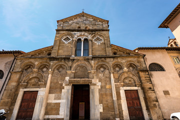 Fototapeta na wymiar Facade of the Church of San Frediano in Romanesque and Baroque style (XI-XVII Century) in Pisa downtown, Piazza San Frediano, Tuscany, Italy, Europe