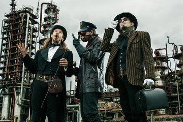 Three mans in steampunk style