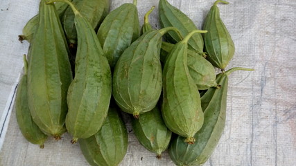 the vegetable of plants are selling in the market outside