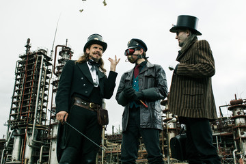 Three mans in steampunk style