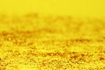 blurred shiny yellow abstraction for festive or autumn background