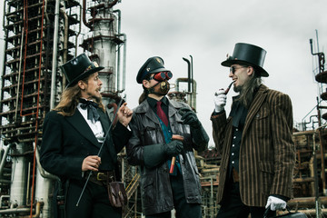 Three mans in steampunk style