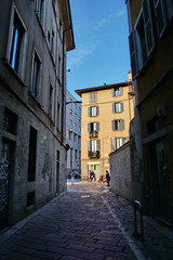 Fototapeta na wymiar Classic European architecture and historical buildings on the city center streets of Milan in Lombardy region in Northern Italy