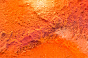 Beautiful bright colorful street art graffiti background. Abstract creative spray drawing fashion colors on the walls of the city. Urban Culture, orange , pink , purple , crimson, blue texture