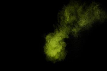 Light green powder explosion on black background. Colored powder cloud. Colorful dust explode. Paint  Holi.