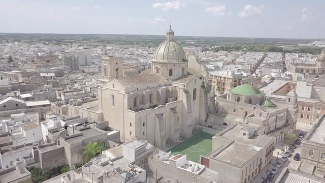 Aerial view of Basilica Minore Pontificia Santissimo Rosario Cathedral in Francavilla Fontana Puglia Italy. Italian religious catholic church baroque architecture. Cityscape.