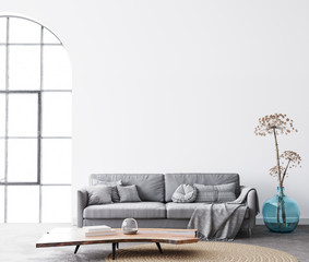 interior living room design with simple white background mock up. Modern grey sofa with cushions and plaid on. Scandinavian bright space concept. 3d render