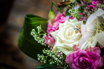Wedding rings in a wedding bouquet