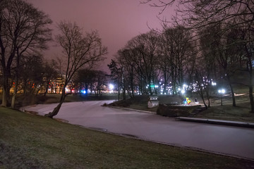 Night winter view of the Bastion Hill town park in historical part of Riga. Latvia.