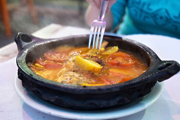 Tajine with stewed vegetables and fish. One of the types of Moroccan national cuisine.