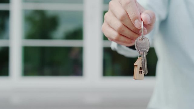 Landlord unlocks the house key for new home