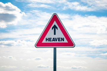 Roadsign with an arrow inside pointing to heaven