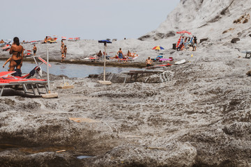 Ponza Island, Italy - 27 July 2019: Family have a nice time on the beautiful beach of the Ponza Island, a Paradise in Italy