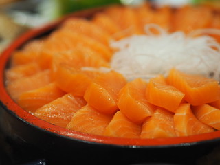 Slice Fresh salmon fish arranged in a wooden tray style Japanese food
