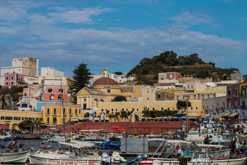 Ponza Island, Italy - 27 July 2019: View of little harbor of Ponza island in the summer season with typical colored houses and boats. Ponza, Italy