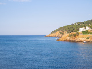 Fototapeta premium Costa Brava coast at Sa Riera fishing village near Palafrugell and Begur towns, Catalunya, Spain. Sea and sunset.