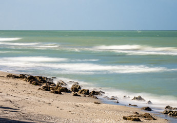 Fototapeta na wymiar Long exposure to blur water of Gulf of Mexico at Caspersen Beach in Venice Florida USA