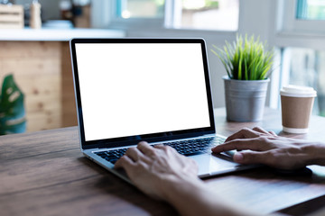 mock up businessman working empty screen computer on wood desk in home
