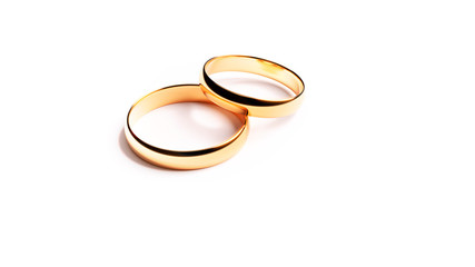 Golden Rings isolated on white background. Beautiful wedding composition for Flyer, Web site or Business cards. Stunning shiny jewelry in best qualuty on the purest White for easy decoration.