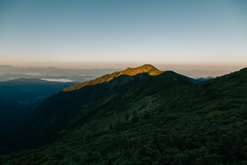 Amazing sunset in the wild ukrainian ridge Marmarosy, near Romania