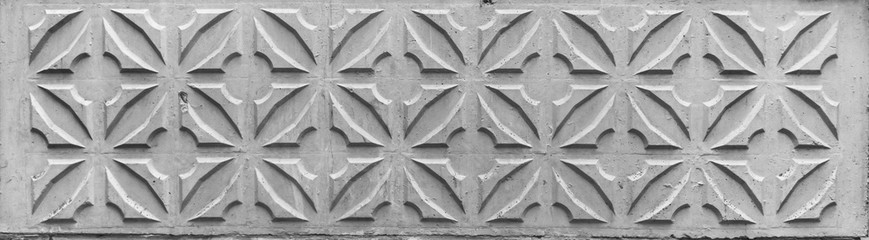 Texture of ols decorative concrete wall panel with ornament for the exterior of the balcony in...